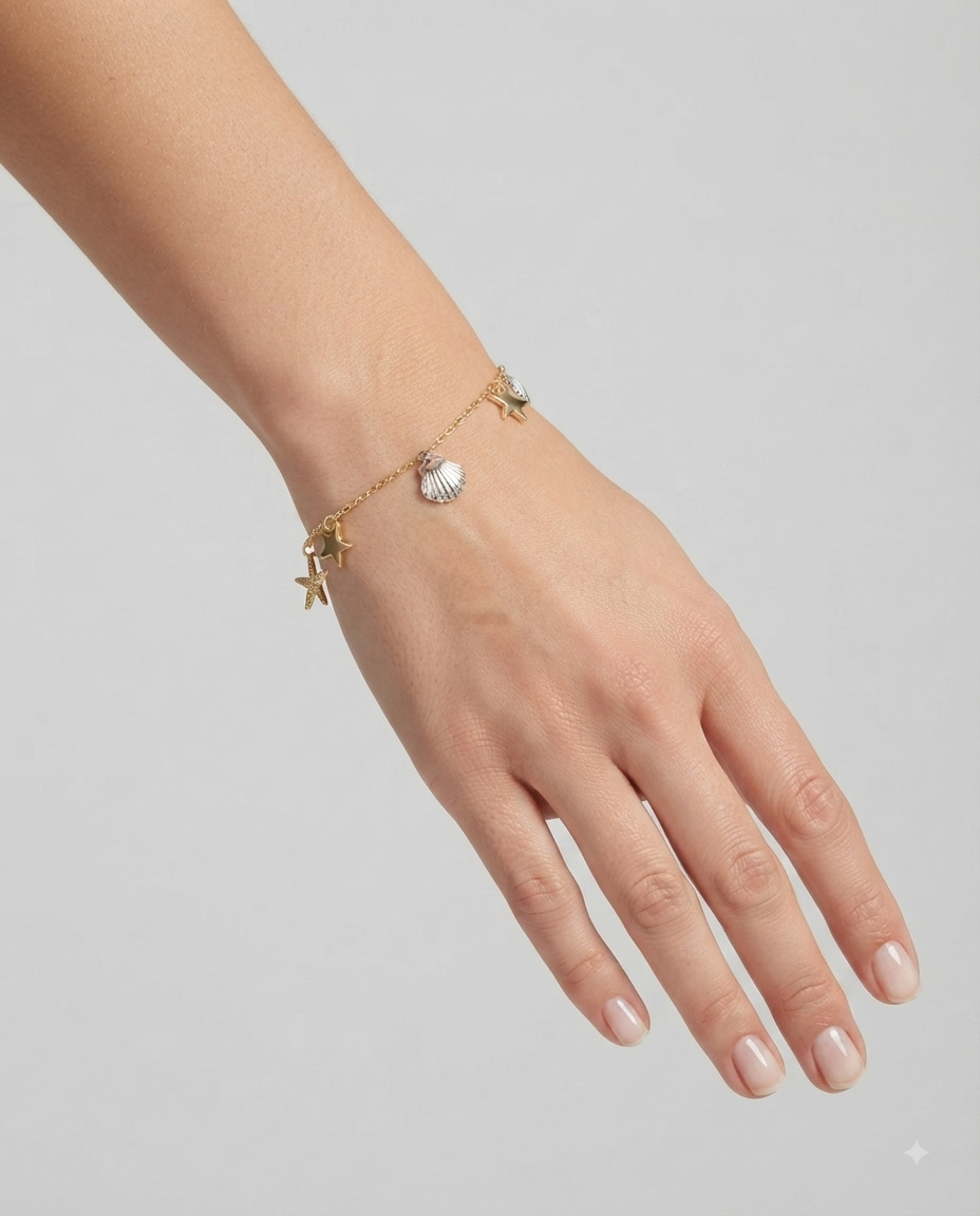 Nine West Pulsera Charms Marinos Dorada