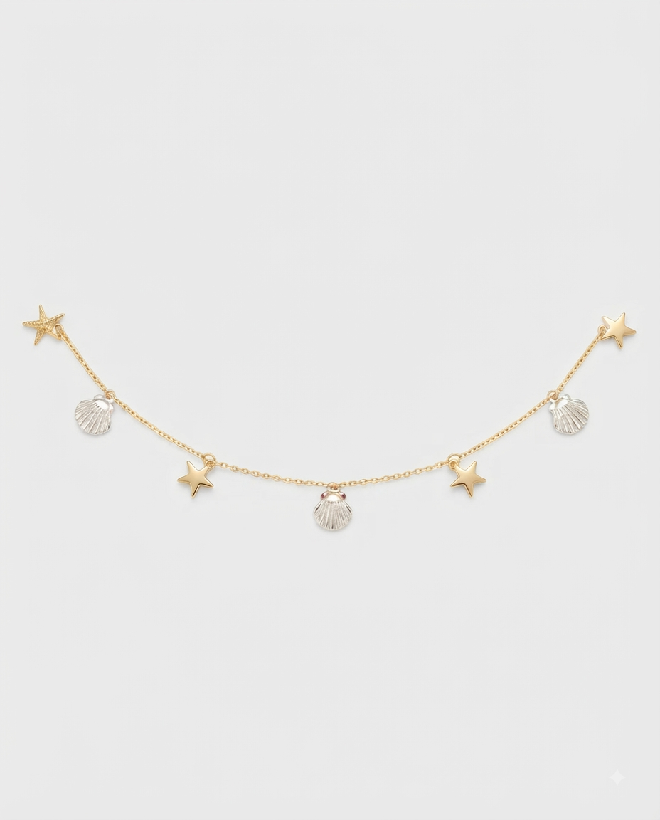 Nine West Pulsera Charms Marinos Dorada