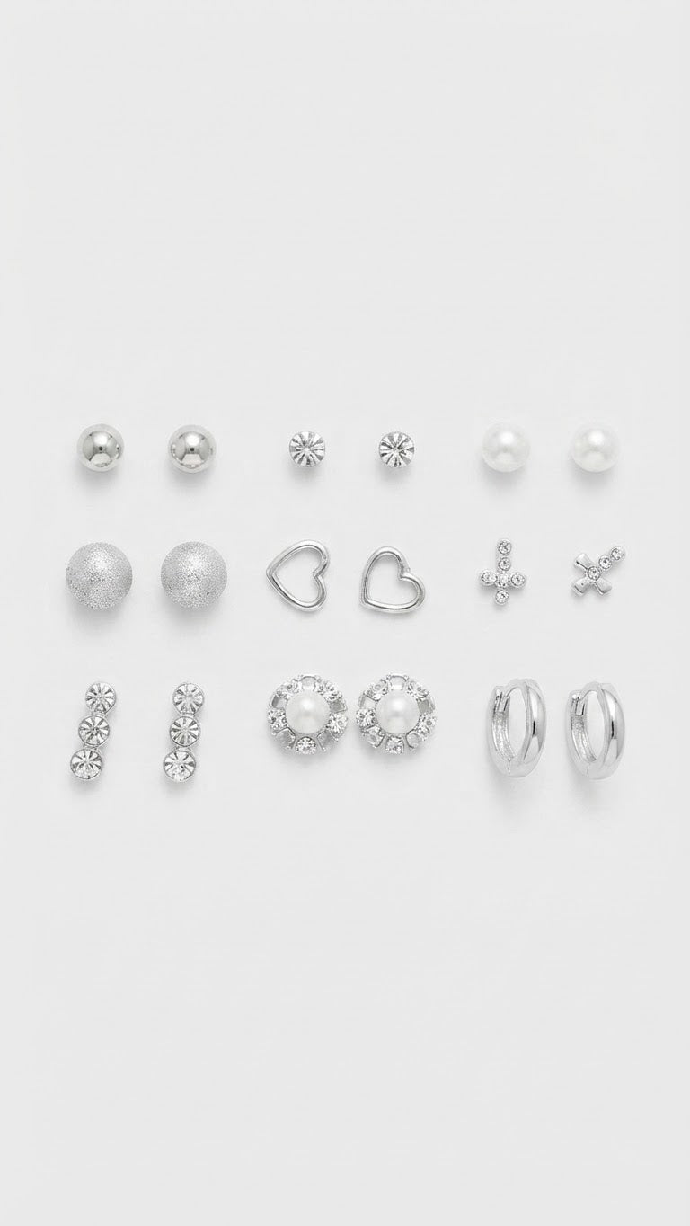 Nicole Miller Set de nueve aretes de perlas y corazones