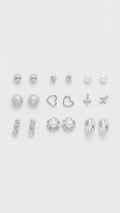 Nicole Miller Set de nueve aretes de perlas y corazones